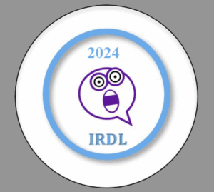 The Zoom Crash badge. It is round, with a light blue circle at the edge. In the center has 2024 up top, an icon of an anthropomorphized chat bubble with frightened eyes and a surprised open mouth, and IRDL at the bottom.